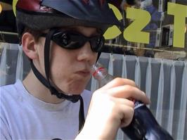 Oliver enjoys a much-needed drink at Estavayer-le-Lac, 14.1 miles into the ride